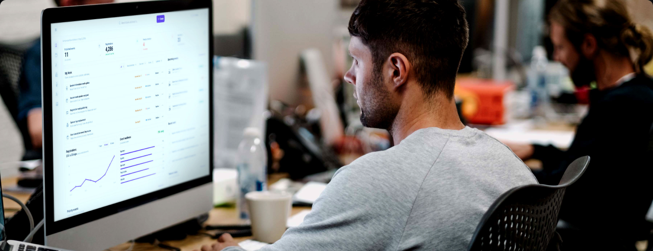Event team member reviewing event information at a desk